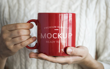 Closeup of woman holding hot drink cup