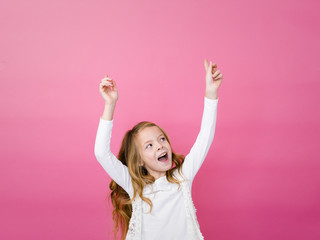 portrait of blond pretty girl in front of pink background with different emotions in the studio