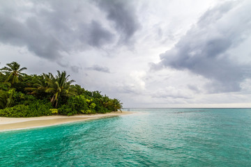 Blue water and white sand in the Maldives