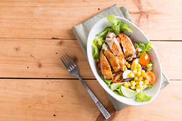 Grilled chicken fillet with colorful salad