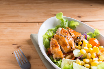 Grilled chicken fillet with colorful salad