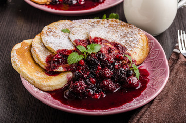 Crepes pancakes with berries reduction