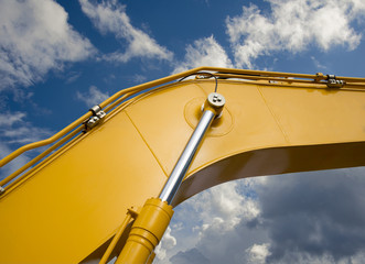 Detail of hydraulic bulldozer piston excavator arm on sky  background