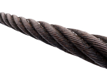 Close-up of diagonal thick rusty metal rope on white background.