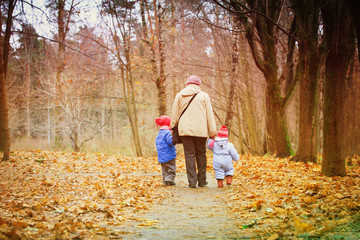 grandmother with kids walk in nature