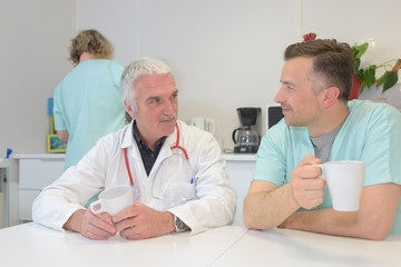 Fototapeta premium medical doctor team taking coffee break