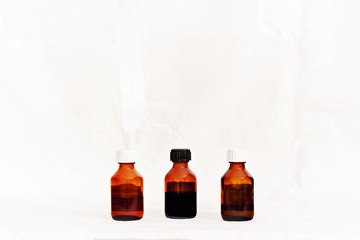 Three bottles of medicine.