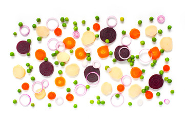 Pattern of cut boiled various vegetables on the white background