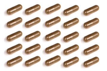 many darkbrown pills isolated on a white background.psd