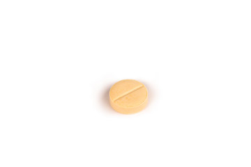 close-up of a light yellow pill isolated on a white backgound.psd