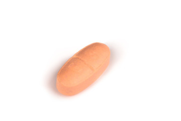 close-up of a soft pink pill isolated on a white backgound.psd