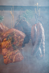 Smoked pork in a homemade smokehouse