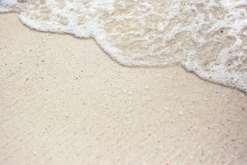 Soft Wave Of Blue Ocean On Sandy Beach