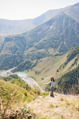 woman admires the view of the mountains