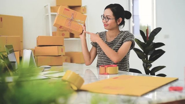 Woman Working at home with Online Business.Asian woman is working with financial documents at workplace in the office.