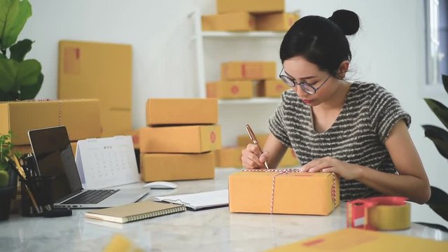 Woman Working at home with Online Business.Asian woman is working with financial documents at workplace in the office.