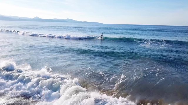 Serfers on a beach in Corsica in France