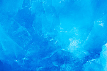 Blue ice wall. Blue ice and mountain. Winter Arctic. White snowy mountain, blue glacier Svalbard, Norway. Ice in ocean. Iceberg t North pole. Glacier, beautiful landscape. Land of cold ice.