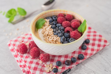 Yogurt with blueberry, raspberry and oatmeal flakes