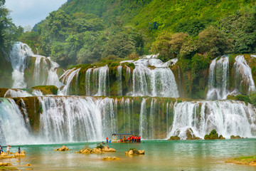 Amazing Ban Gioc waterfall flow down fluted in Cao Bang province, Vietnam.  Ban Gioc waterfall is one of the top 10 waterfalls in the world and along Vietnamese and Chinese border