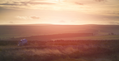 Sunset over forest and farmland in the English Countryside. Edmondbyres Common, UK.