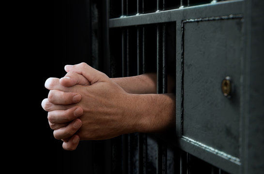 Jail Cell Door And Hands