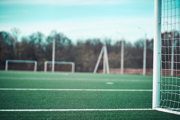 Close up on soccer field with artificial grass and white stripes