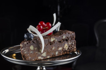 a piece of chocolate cake with nuts