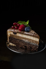 a piece of chocolate cake with berries