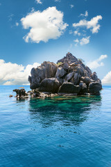 The fisherman village placed on the big rock, Moo Koh Chumphon, Chumohon province, Thailand. Bird's Nest Collectors' Bungalows perched atop Ko Ngam Noi