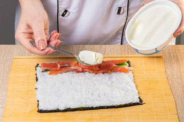 Chef prepares rolls, hands closeup