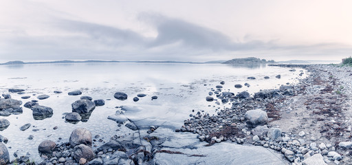 Panoramic landscape of Northern Sea coastline in Sweden. Morning scenery in fresh blue tone color.