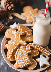 Milk and cookies. Gingerbread  cookies on a gray background.  Christmas cookies.  Ginger men