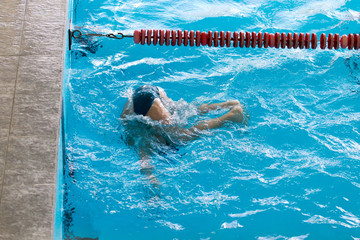 boy on a swim in a sports pool