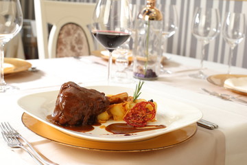 Restaurant meal, meat dish and vegetables plating