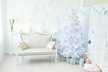 Interior living room with a Christmas tree with gift boxes and decorations.