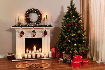Living room home interior with decorated fireplace and christmas tree. Christmas warm cozy interior room, in anticipation of the holiday. New year design.