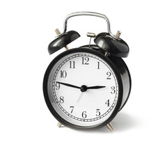 black alarm clock with white dial side view.
