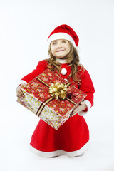 Little girl red dress santa hat with gift on white background