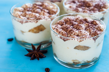 luxurious dessert tiramisu in glasses, the concept of sweet life 