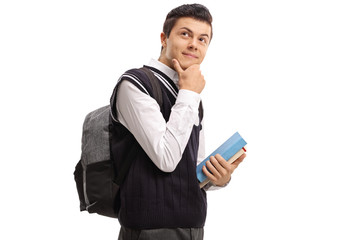 Teen student with a backpack and books thinking