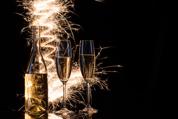 Celebration of champagne in the sparks of Bengal lights