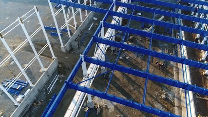 Plant Construction, Construction of a large factory, Industrial exterior, Construction site, aerial view, metal and concrete structures, construction machinery