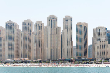 Fototapeta na wymiar Beautiful panoramic view of Dubai Marina beach with skyscrapers in the background in Dubai, UAE