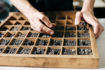 Man working in printing press workshop