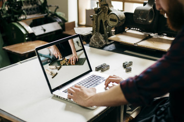 Crop man watching tutorial video