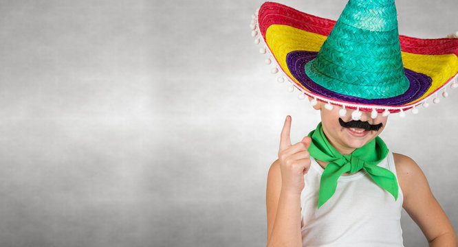 Funny  boy with a fake mustache Mexican sombrero.