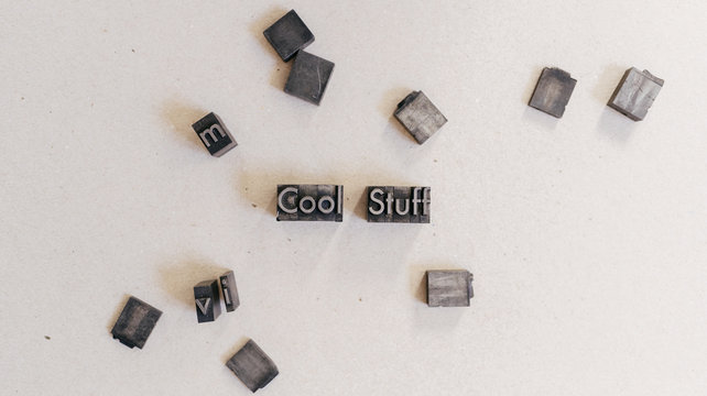 Crop man arranging printing letters