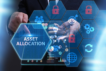 Business, Technology, Internet and network concept. Young businessman working on a virtual screen of the future and sees the inscription: Asset allocation