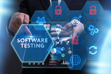 Business, Technology, Internet and network concept. Young businessman working on a virtual screen of the future and sees the inscription: Software testing